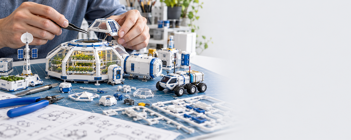 Polvenar miniature habitat being assembled by hand